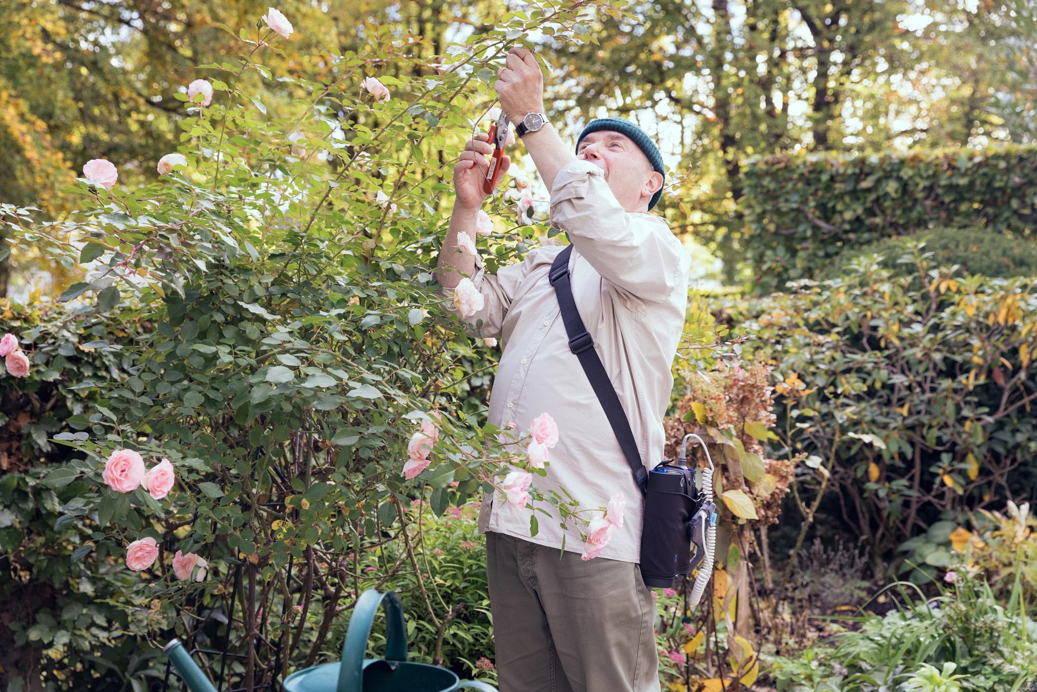 Portrait of a confident professional man with crossed arms standing outdoors in a modern urban environment